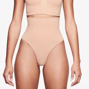 SKIMS Seamless Sculpt Mid Waisted Core Control Thong In Mica Shaping Shapewear